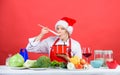 Try main meal. Easy ideas for christmas party. Healthy christmas holiday recipes. Woman chef santa hat cooking hold