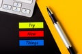 Try New Things colorful memo on workplace background. Motivation is getting better, knowing the world