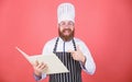 Try something new. Cookery on my mind. Improve cooking skill. Book recipes. According to recipe. Man bearded chef Royalty Free Stock Photo