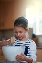 Trying her hand at baking. a little girl baking in the kitchen. Royalty Free Stock Photo