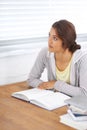 Trying to overcome a problem. A beautiful college student trying to overcome a study block in her dorm room.