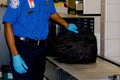 TSA handling a bag Royalty Free Stock Photo