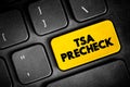 TSA PreCheck - lets eligible, low-risk travelers enjoy expedited security screening, text button on keyboard, concept background