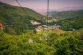 TSAGHKADZOR, ARMENIA - JULY 11, 2021: Aerial views from the ropeway cable car over the green forests on the mountainside of the