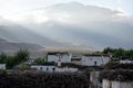 Tsarang village at sunset against the background of the Himalayas.