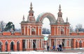 Tsaritsyno park in Moscow. People walk under the gates.