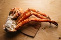 Tsaty crab claws on wooden table Royalty Free Stock Photo