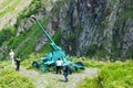 Tourists look at the anti-avalanche cannon in the Tsey gorge in North Ossetia, Russia