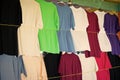 Tshirts hang in local shop or market in castries, st.lucia. Colorful clothes on sale. Sale, shopping and purchase. Black Royalty Free Stock Photo