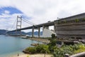 Tsing Ma Double-decked Suspension Bridge and Noah`s Ark, Ma Wan, Hong Kong Royalty Free Stock Photo