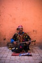 TStreet musician in traditional clothing on street Royalty Free Stock Photo