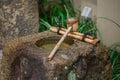 Tsukubai Japan stone water washbasin Royalty Free Stock Photo