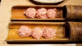 Tsukune is a type of Japanese meatball most often made from seasoned chicken mince. Served in a bamboo skewer and cook them Royalty Free Stock Photo