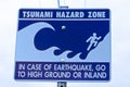 A tsunami hazard zone sign warning along the coast Royalty Free Stock Photo