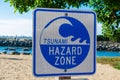 Tsunami Hazard Zone warning sign on the Pacific Ocean coast warns public about possible danger after earthquake Royalty Free Stock Photo