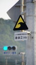 Tsunami warning sign in harbour of Kushimoto, Japan Royalty Free Stock Photo