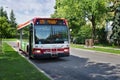TTC bus on a quiet street in summer. Toronto Transit Commission offers all sorts of city public transportation - subway