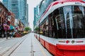 TTC Close view os a streetcar in downtown Toronto\'s entertainment district. New tram on streets of Toronto. TORONTO, ONTARIO