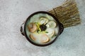 tteok mandu guk, Korean style dumpling soup with sliced rice cake Royalty Free Stock Photo