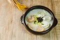 tteok mandu guk, Korean style dumpling soup with sliced rice cake Royalty Free Stock Photo