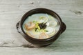 tteok mandu guk, Korean style dumpling soup with sliced rice cake Royalty Free Stock Photo