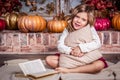 Little happy girl. Baby girl hugging pillow. Girl with pumpkins Royalty Free Stock Photo