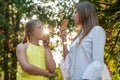 Ttwo teen girls friends having fun and eating ice cream. People, children, friends and friendship concept Royalty Free Stock Photo