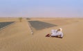 Tuareg man in a desert resting and drinking tea Royalty Free Stock Photo