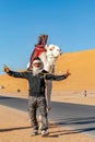 Tuareg man posing with his dromedary Royalty Free Stock Photo