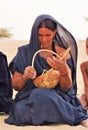 TUAREG WOMAN PLAYING LAUD IN THE SAHARA