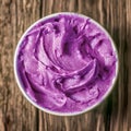 Tub of colorful purple berry ice cream