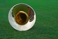 Tuba lying on the grass