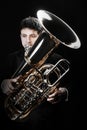 Tuba player. Brass musicians with instruments Royalty Free Stock Photo