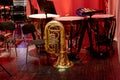 tuba and timpani of a symphony orchestra stand on stage