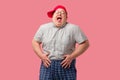 Tubby man laughs happily, with his hands on belly, expresses positive emotions. Royalty Free Stock Photo