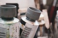 Tube of acrilic and oil paint for painting with more painting stuff on the background. Selective focus Royalty Free Stock Photo