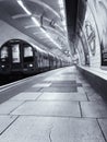Tube arriving on London Underground platform Royalty Free Stock Photo