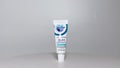 A tube of Crest ProHealth Gum Detoxify toothpaste on a white background