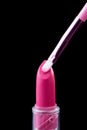 Tube of lipstick with a brush make-up on black Royalty Free Stock Photo