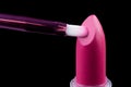 Tube of lipstick with a brush make-up on black Royalty Free Stock Photo