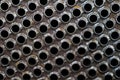 Tube sheet of the heat exchanger for new fabrication, the water heater in the boiler as background Royalty Free Stock Photo