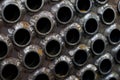 Tube sheet of the heat exchanger for new fabrication, the water heater in the boiler as background Royalty Free Stock Photo