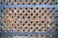 Tube sheet plate of heat exchanger or boiler closeup texture macro industrial background with insoluble hard mineral