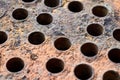 Tube sheet or plate of heat exchanger boiler closeup texture selective focus background opened for inspection