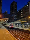 Tube train running into Barbican Station at night