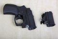 Tubeless doubly charged traumatic pistol and holder