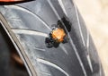 Tubeless motorcycle front wheel repaired with a sulfide strip