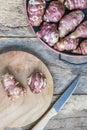 Tuber Jerusalem artichoke vegetables on wooden cutting board to preparing food Royalty Free Stock Photo