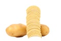 Tubers of potato and stack chips. Royalty Free Stock Photo