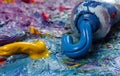 Tubes with art oil paint on a palette. colorful art paints close-up